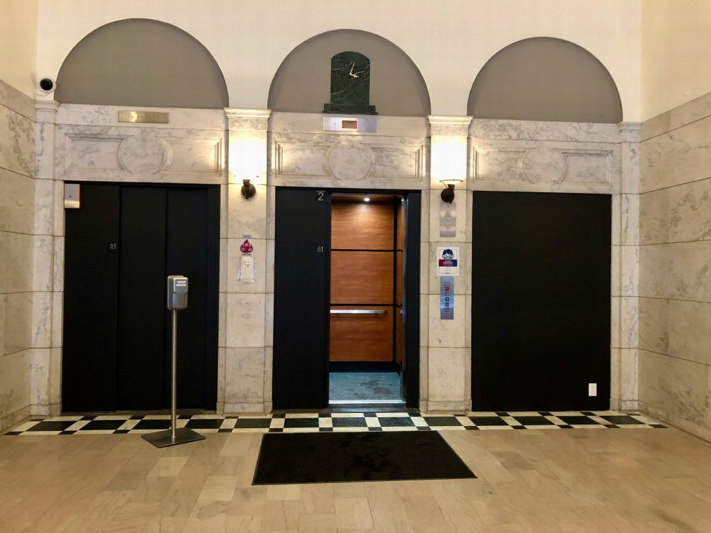 Step 3: Take the middle elevator to the 8th floor
