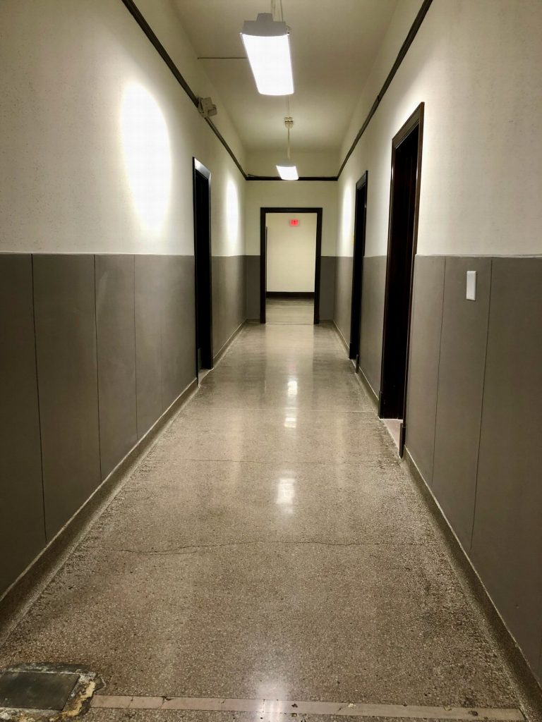 Step 6: Walk towards the exit sign and then turn left
